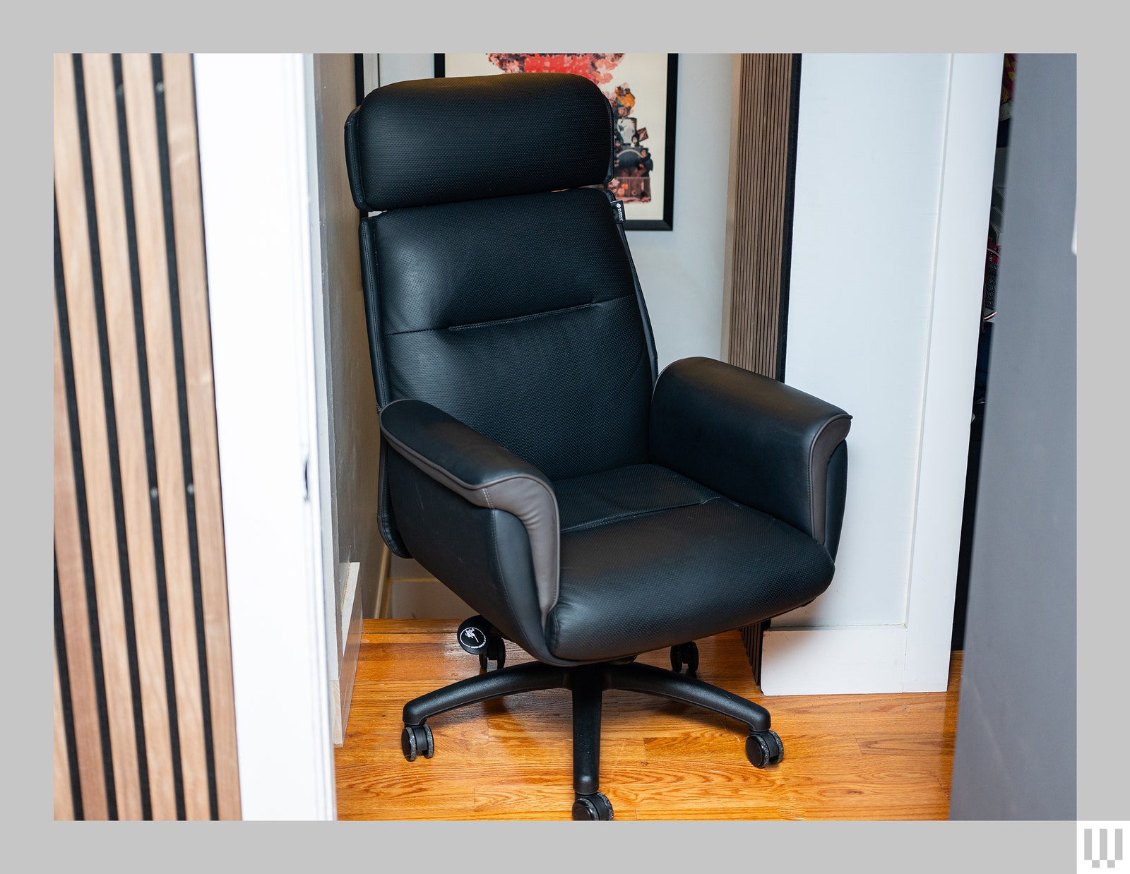 Front view of the Eureka Ergonomic Royal a black office chair with padded back support cushioned sides and extensions...