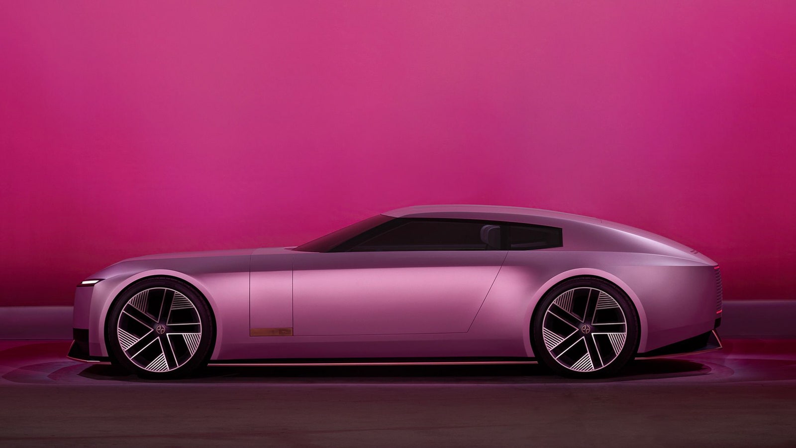 a sleek pink car
