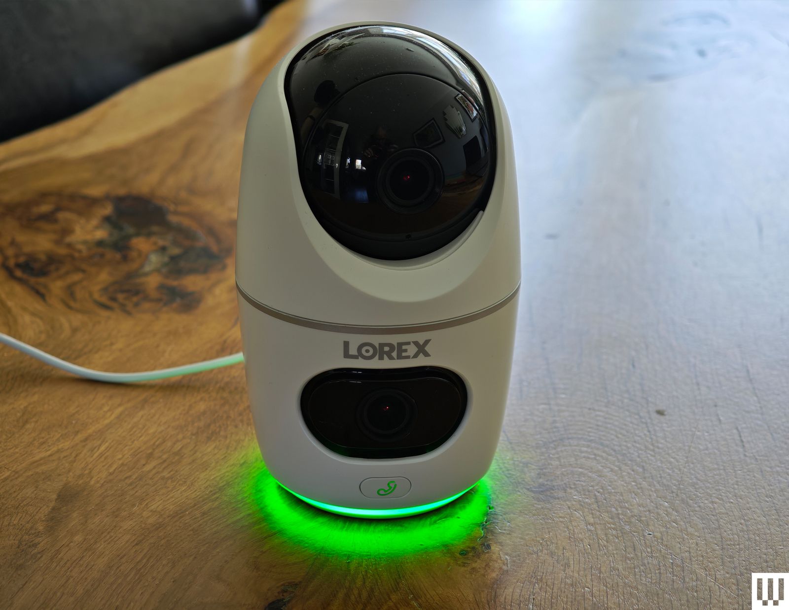 Image may contain Electronics Speaker Camera and Light