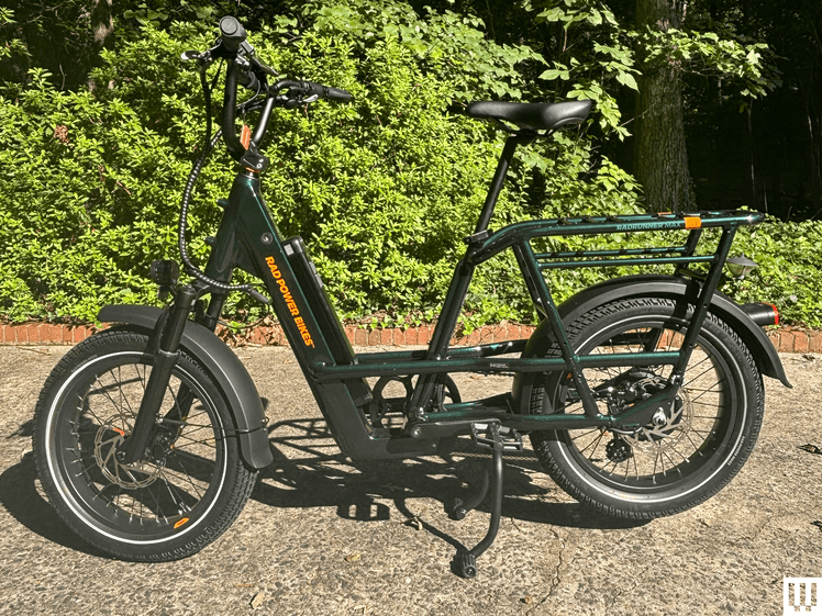 Image may contain: Moped, Motor Scooter, Motorcycle, Transportation, Vehicle, Bicycle, Machine, and Wheel