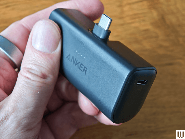 Image may contain: Body Part, Finger, Hand, Person, Adapter, Electronics, Mobile Phone, and Phone