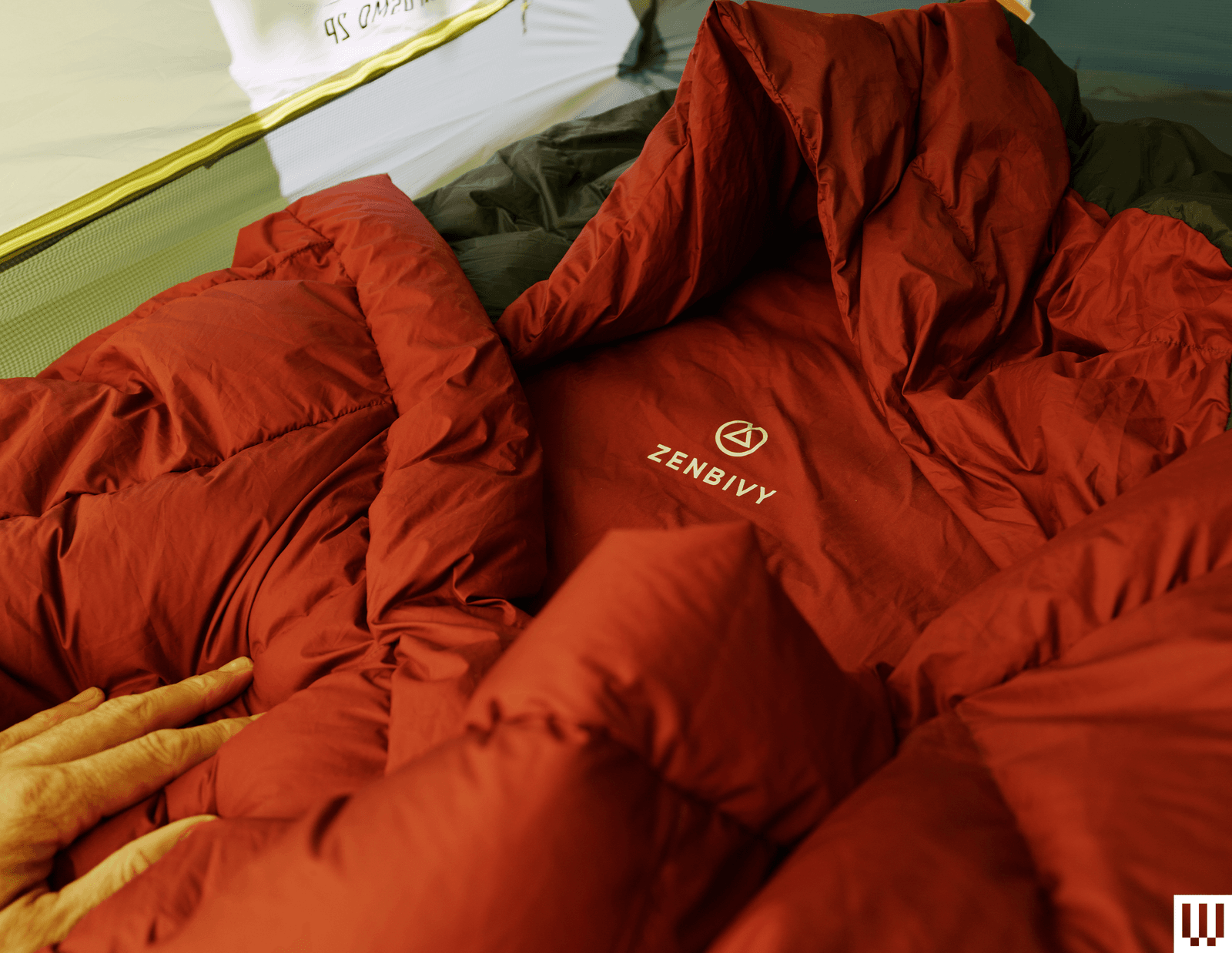 Image may contain Clothing Coat Jacket Blanket Bed Furniture Baby and Person