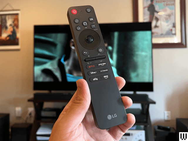 Image may contain: Electronics, Remote Control, Computer Hardware, Hardware, Monitor, Screen, TV, and Person