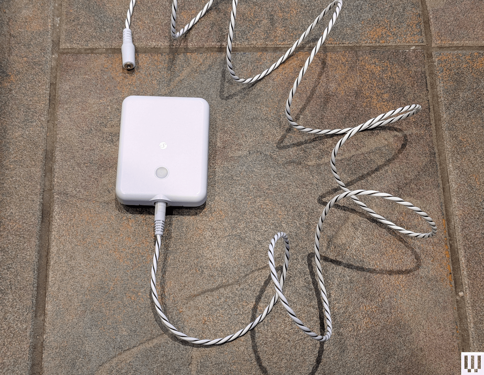 Image may contain Rope Adapter Electronics Hardware and Phone