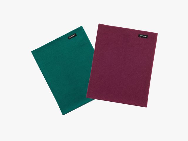 2 pieces of rectangular fabric overlapping, one in green and one in red, to show the Turtle Fur Merino Pipe Dream Neck Gaiters