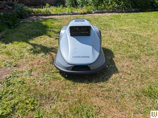 Image may contain: Grass, Lawn, Plant, Device, Lawn Mower, and Tool