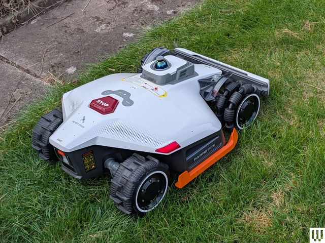 Image may contain: Grass, Lawn, Plant, Device, Lawn Mower, Tool, Machine, and Wheel